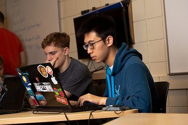 Image of a Student Focusing On a Laptop