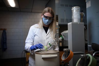Image of a Woman Conducting a Science Experiment